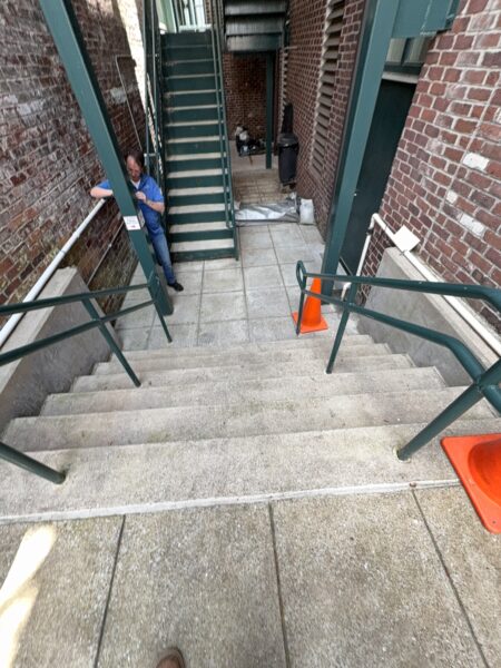 This project involved a comprehensive exterior soft wash and concrete power washing of a commercial property in Chattanooga, utilizing a 60-foot manlift to safely and thoroughly clean the building's masonry, sidewalks, stairs, and roof.