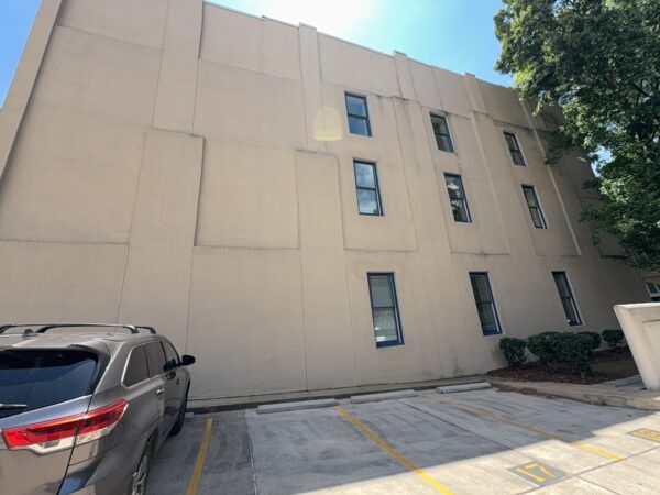 This project involved a comprehensive exterior soft wash and concrete power washing of a commercial property in Chattanooga, utilizing a 60-foot manlift to safely and thoroughly clean the building's masonry, sidewalks, stairs, and roof.