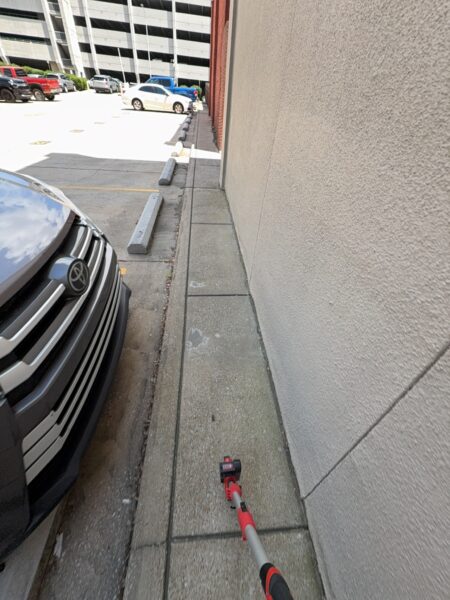 This project involved a comprehensive exterior soft wash and concrete power washing of a commercial property in Chattanooga, utilizing a 60-foot manlift to safely and thoroughly clean the building's masonry, sidewalks, stairs, and roof.