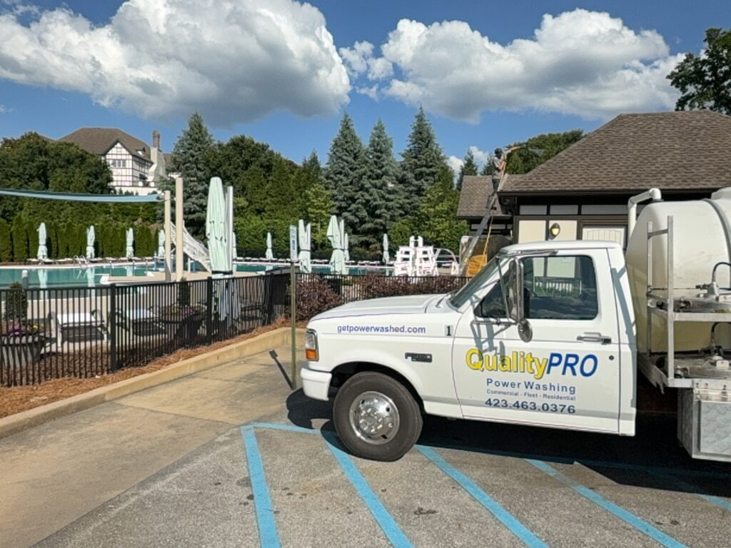 This project involved a comprehensive three-phase exterior cleaning of a commercial snack building in Chattanooga, utilizing customized power washing and soft washing techniques to safely remove organic growth and debris from the concrete walkways, masonry walls, and asphalt shingle roof.
