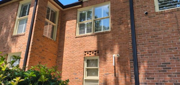 This seasonal maintenance project at a two-story Chattanooga residence involved thoroughly clearing leaves and debris from the roofline and leaf-guard-equipped gutter system, followed by a detailed exterior cleaning of the windows and both sides of several glass doors.