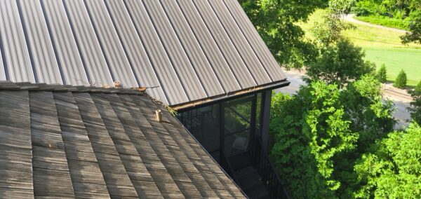This seasonal maintenance project at a two-story Chattanooga residence involved thoroughly clearing leaves and debris from the roofline and leaf-guard-equipped gutter system, followed by a detailed exterior cleaning of the windows and both sides of several glass doors.