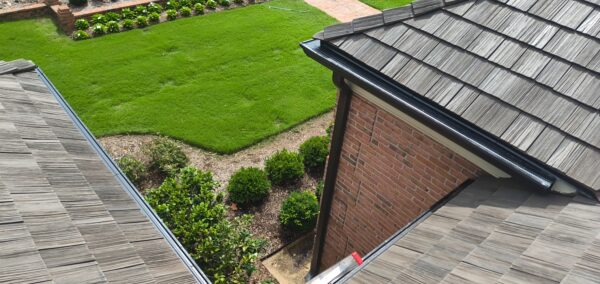 This seasonal maintenance project at a two-story Chattanooga residence involved thoroughly clearing leaves and debris from the roofline and leaf-guard-equipped gutter system, followed by a detailed exterior cleaning of the windows and both sides of several glass doors.