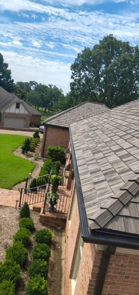 This seasonal maintenance project at a two-story Chattanooga residence involved thoroughly clearing leaves and debris from the roofline and leaf-guard-equipped gutter system, followed by a detailed exterior cleaning of the windows and both sides of several glass doors.