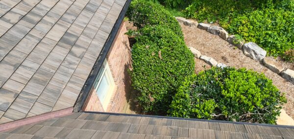 This seasonal maintenance project at a two-story Chattanooga residence involved thoroughly clearing leaves and debris from the roofline and leaf-guard-equipped gutter system, followed by a detailed exterior cleaning of the windows and both sides of several glass doors.