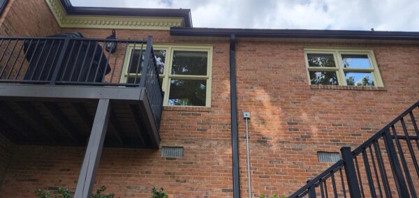 This seasonal maintenance project at a two-story Chattanooga residence involved thoroughly clearing leaves and debris from the roofline and leaf-guard-equipped gutter system, followed by a detailed exterior cleaning of the windows and both sides of several glass doors.