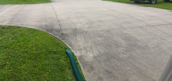 This project involved a comprehensive exterior refresh of a two-story Chattanooga home, including a soft-wash house cleaning with a mold warranty, a driveway concrete wash, gutter debris removal, and exterior window cleaning to restore both curb appeal and functionality.
