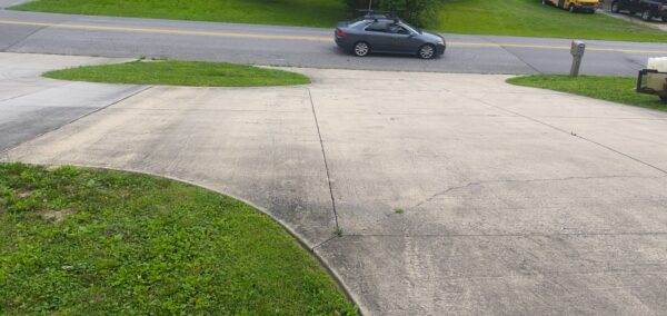 This project involved a comprehensive exterior refresh of a two-story Chattanooga home, including a soft-wash house cleaning with a mold warranty, a driveway concrete wash, gutter debris removal, and exterior window cleaning to restore both curb appeal and functionality.