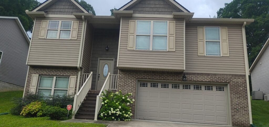 This project involved a comprehensive exterior refresh of a two-story Chattanooga home, including a soft-wash house cleaning with a mold warranty, a driveway concrete wash, gutter debris removal, and exterior window cleaning to restore both curb appeal and functionality.