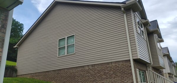 This project involved a comprehensive exterior refresh of a two-story Chattanooga home, including a soft-wash house cleaning with a mold warranty, a driveway concrete wash, gutter debris removal, and exterior window cleaning to restore both curb appeal and functionality.