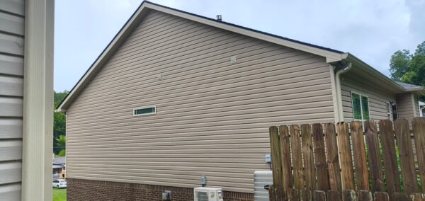 This project involved a comprehensive exterior refresh of a two-story Chattanooga home, including a soft-wash house cleaning with a mold warranty, a driveway concrete wash, gutter debris removal, and exterior window cleaning to restore both curb appeal and functionality.