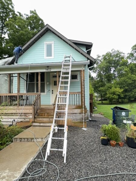 Using low-pressure soft washing methods, this project completed a full exterior refresh of a two-story home in Chattanooga, which included cleaning the house siding, front porch and back steps, washing the metal roof, and clearing and flushing the gutter system.