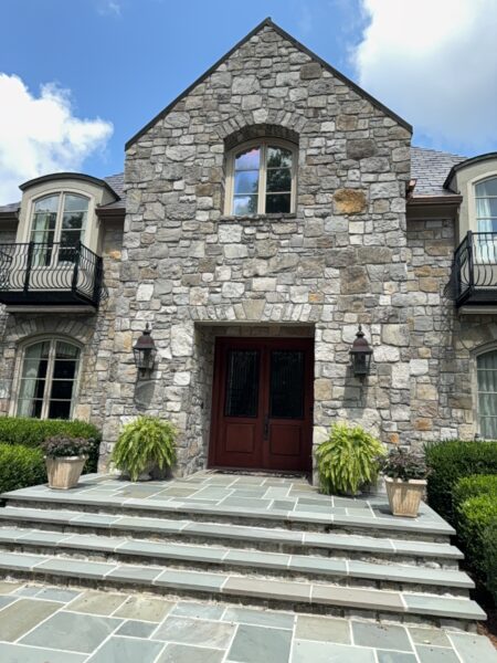 This project involved a comprehensive soft wash and power rinse of a two-story residence in Signal Mountain, including its siding, pool deck, stone fireplace, metal fencing, patio furniture, and multi-level brick, stone, and wood patios to remove mold, mildew, and environmental buildup.