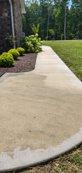 This project involved a comprehensive exterior soft wash of a one-story residence in Rising Fawn to remove organic buildup and meet a one-year mold warranty, alongside a detailed concrete cleaning of the front walkway and garage pad using pre-treatment and a surface washer.
