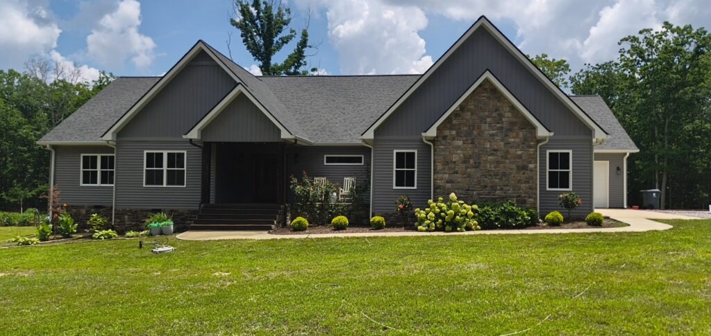 This project involved a comprehensive exterior soft wash of a one-story residence in Rising Fawn to remove organic buildup and meet a one-year mold warranty, alongside a detailed concrete cleaning of the front walkway and garage pad using pre-treatment and a surface washer.