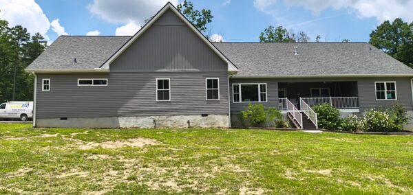 This project involved a comprehensive exterior soft wash of a one-story residence in Rising Fawn to remove organic buildup and meet a one-year mold warranty, alongside a detailed concrete cleaning of the front walkway and garage pad using pre-treatment and a surface washer.