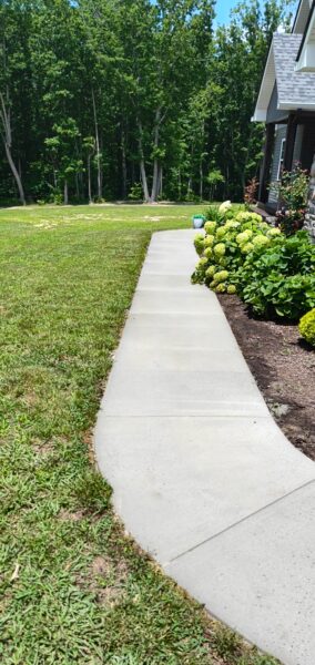 This project involved a comprehensive exterior soft wash of a one-story residence in Rising Fawn to remove organic buildup and meet a one-year mold warranty, alongside a detailed concrete cleaning of the front walkway and garage pad using pre-treatment and a surface washer.
