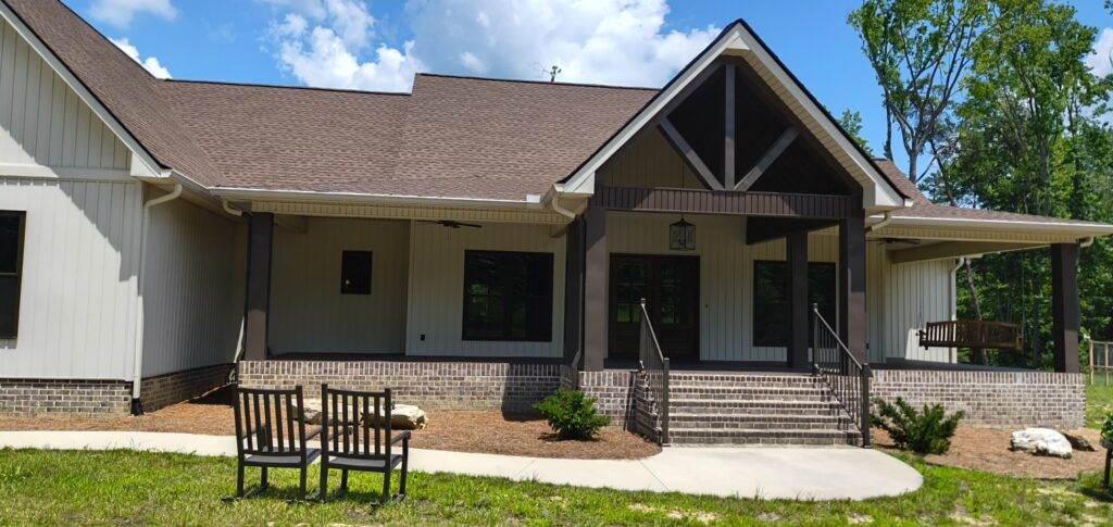 A complete exterior soft wash was performed on a one-story residence in Rising Fawn, thoroughly cleaning the soffits, fascia, gutters, downspouts, and siding using a low-pressure system and gentle agitation to safely remove organic growth and dirt.