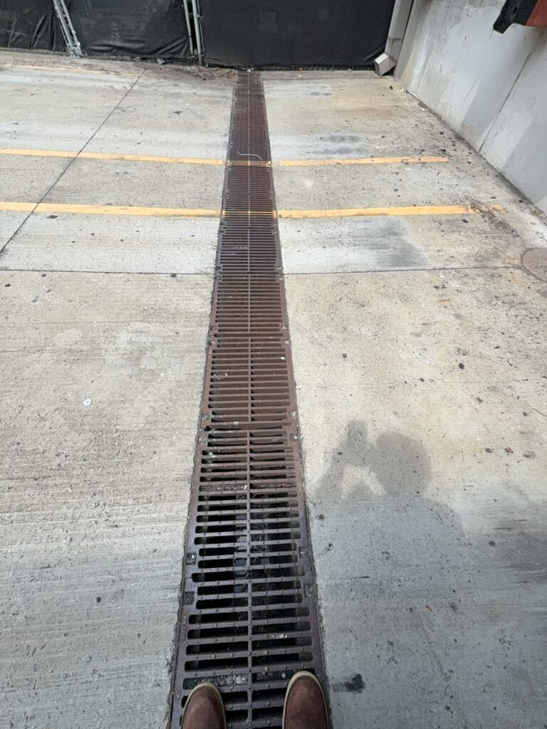 This project involved a comprehensive exterior cleaning of a dumpster area in Collegedale, including debris removal, drain clearing, and pressure washing to restore sanitation and improve appearance.