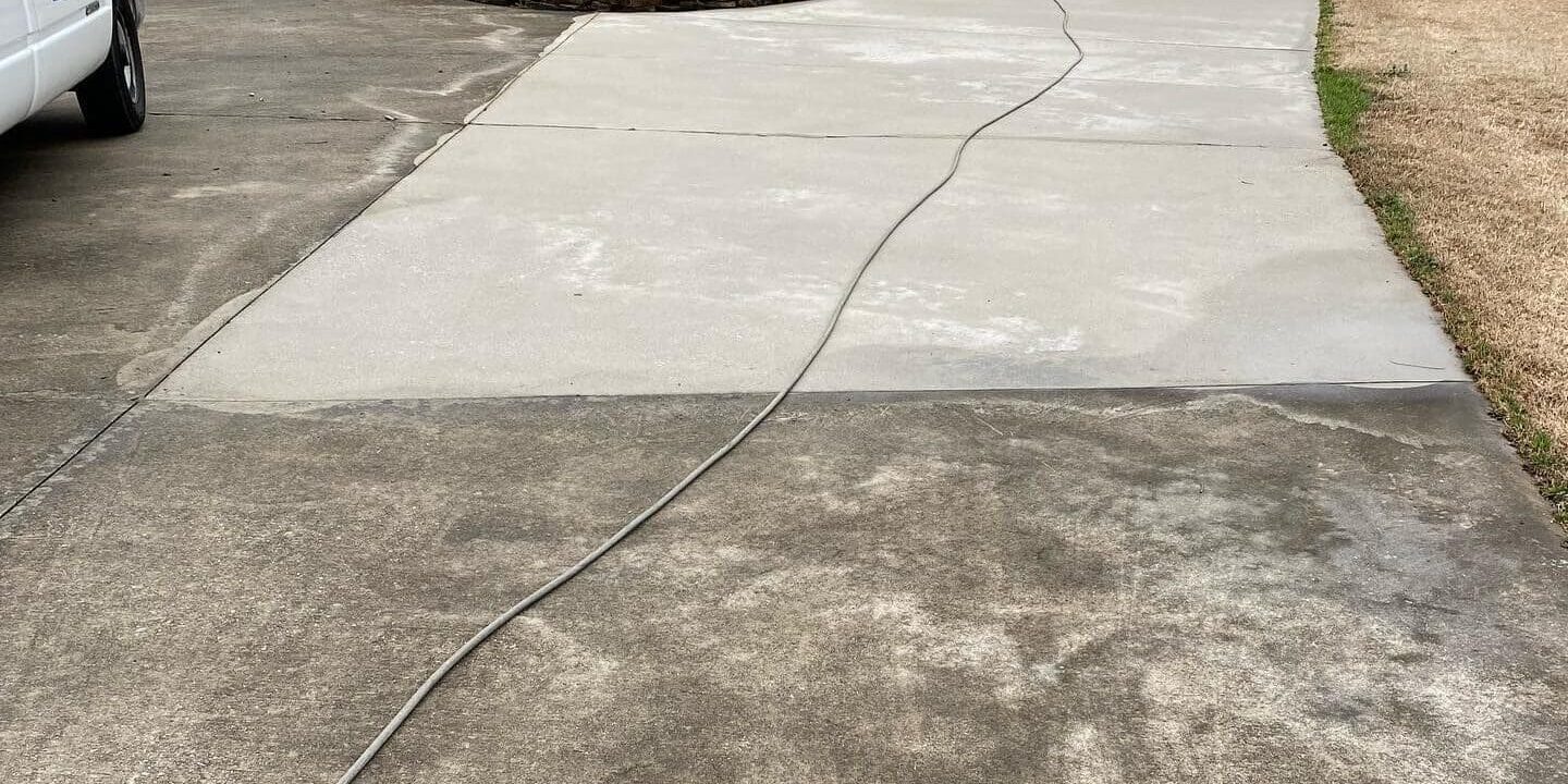 Before & after concrete driveway pressure washing in Chattanooga TN by QualityPRO Power Washing